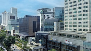 A modern hotel with a glass facade, a visible entrance, and a sign for 'Holiday Inn Express'. - Holiday Inn Express Singapore Orchard Road by IHG (Singapore)