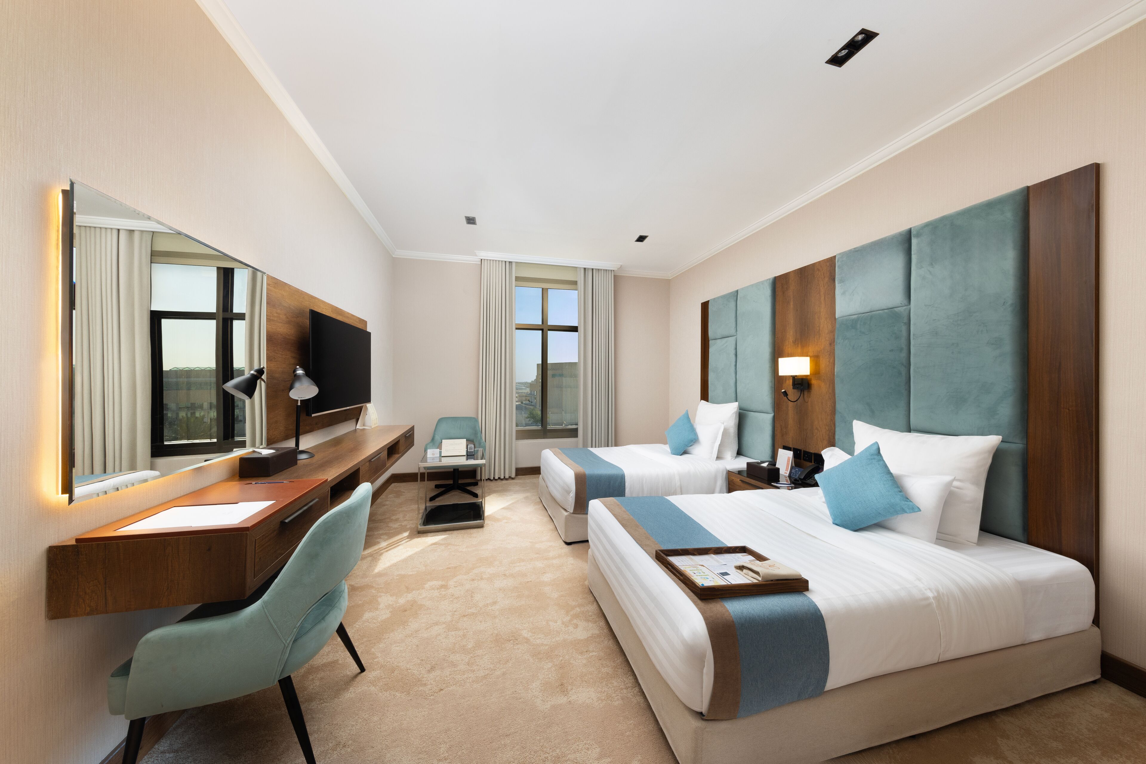 Standard Twin Room | Minibar, in-room safe, laptop workspace, iron/ironing board