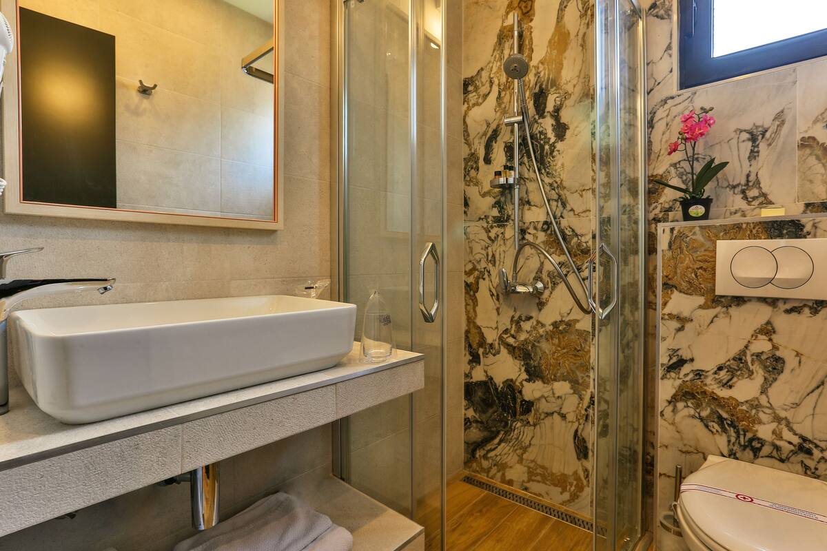 rainfall showerhead, free toiletries, hair dryer, bathrobes