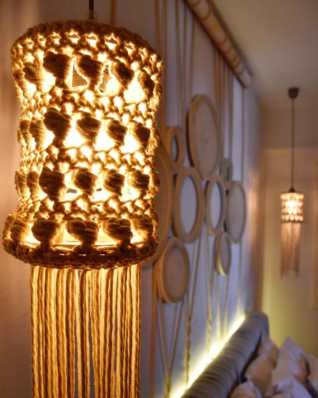 A textured, cylindrical light fixture with a warm glow, hanging from the ceiling.