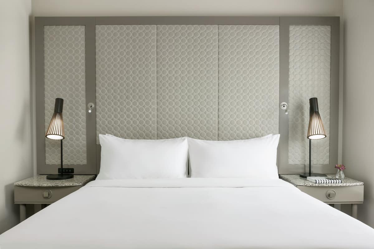Hypo-allergenic bedding, down duvets, pillow-top beds, in-room safe