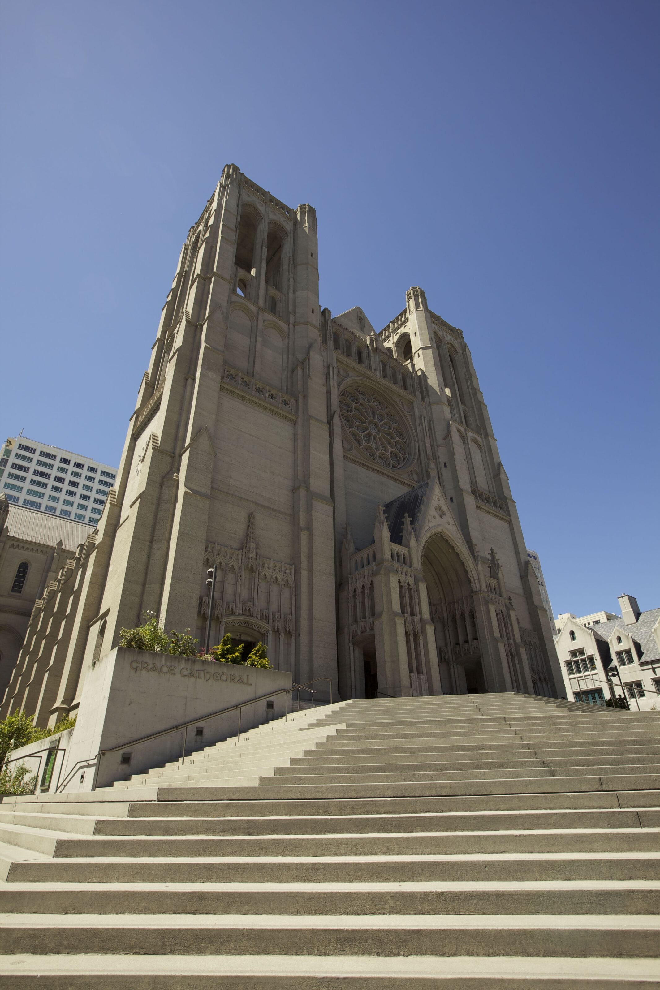 A large cathedral with a prominent rose window and a tall bell tower.