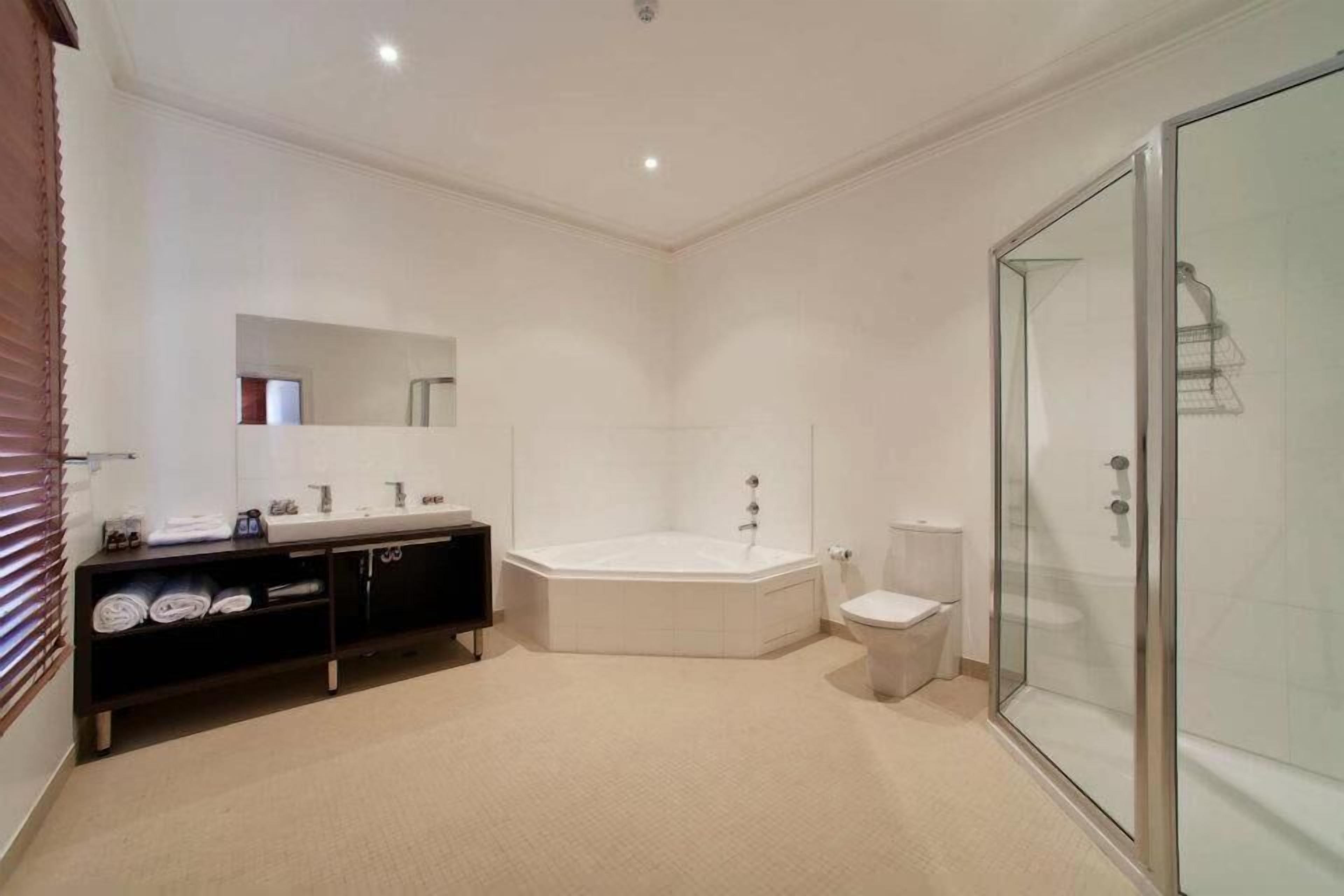 shower, hair dryer, bathrobes, slippers