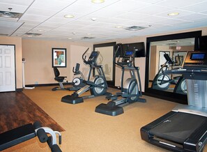 A hotel fitness center with treadmills, elliptical machines, and a stationary bike. - Holiday Inn Express & Suites Wichita Northeast by IHG (Wichita)