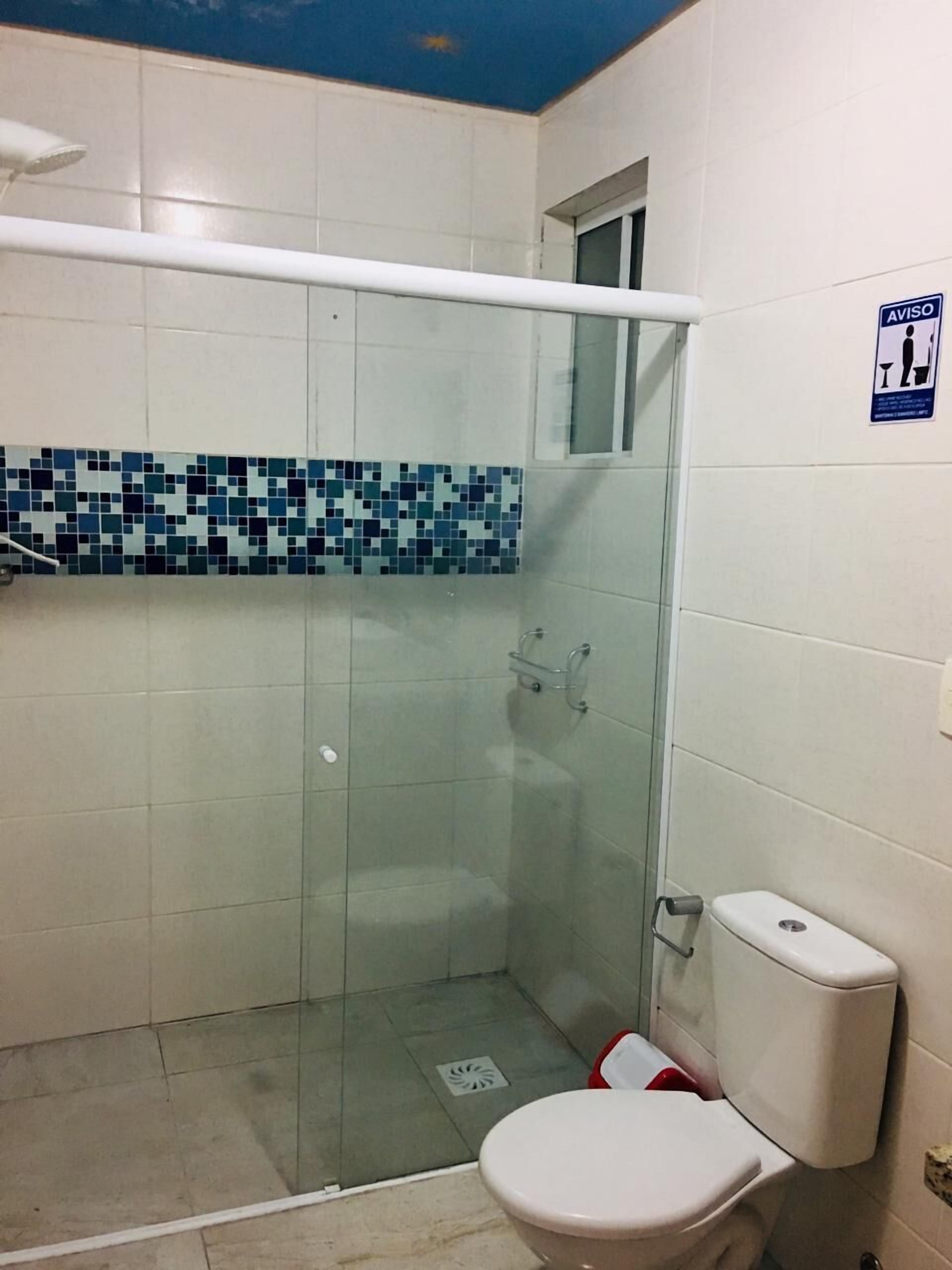 economy twin room | bathroom | shower, hair dryer, towels