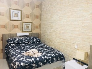 Apartamento standard, 2 quartos | Frigobar, escrivaninha, cortinas blackout, Wi-Fi de cortesia