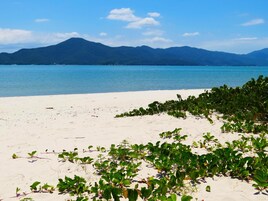 Beach nearby, white sand, sun loungers, beach umbrellas