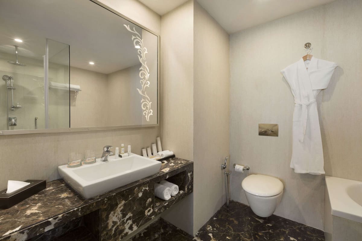 Suite Room with 2 Way Airport Transfers | Premium bedding, minibar, in-room safe, desk