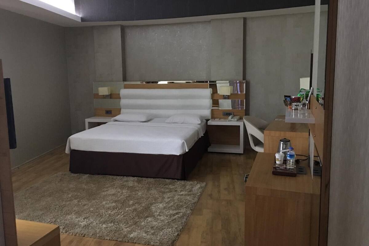 Superior Double Room | Minibar, in-room safe, desk, iron/ironing board