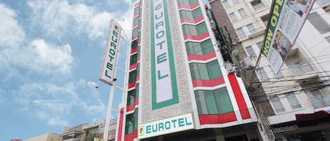 A multi-story building with a prominent Eurotel sign, indicating a hotel.