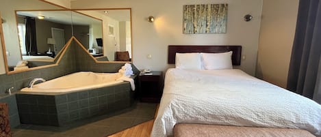 Deluxe Room, 1 Queen Bed, Jetted Tub | Desk, rollaway beds, free WiFi