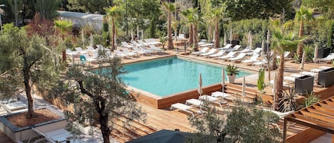 Indoor pool, seasonal outdoor pool, pool umbrellas, pool loungers