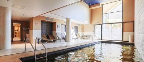 Indoor pool, seasonal outdoor pool, pool umbrellas, sun loungers