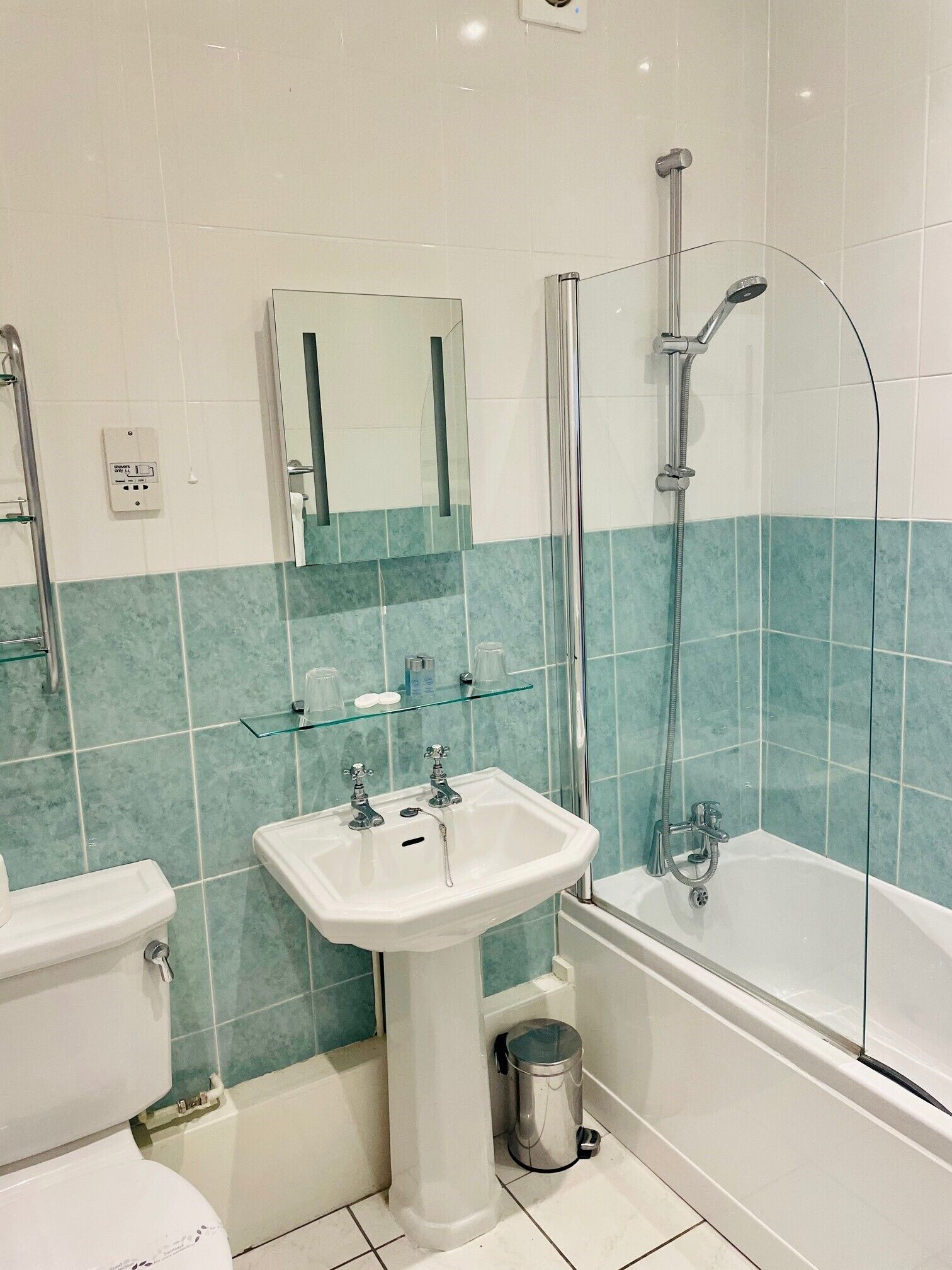 A bathroom with a sink, toilet, and bathtub.