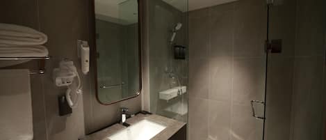 Shower, hair dryer, slippers, towels