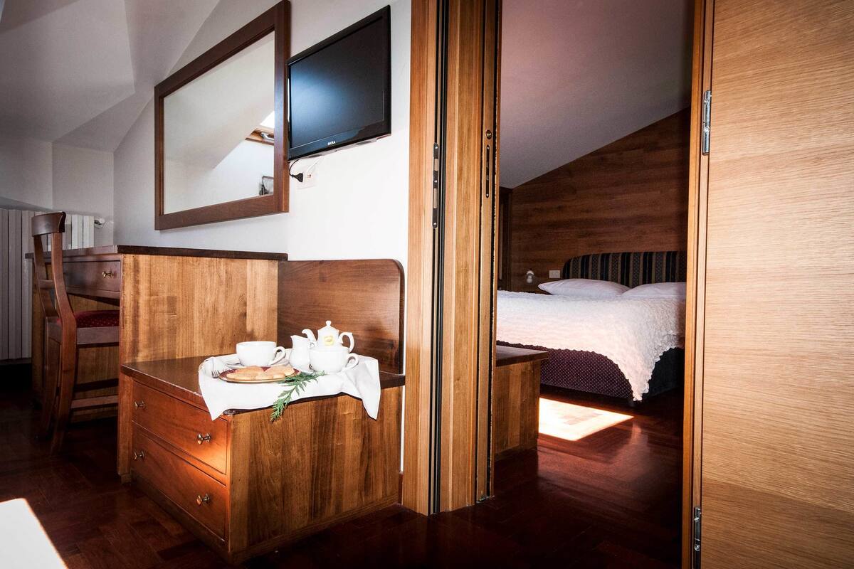 Quarto família | Frigobar, cofres nos quartos, Wi-Fi de cortesia