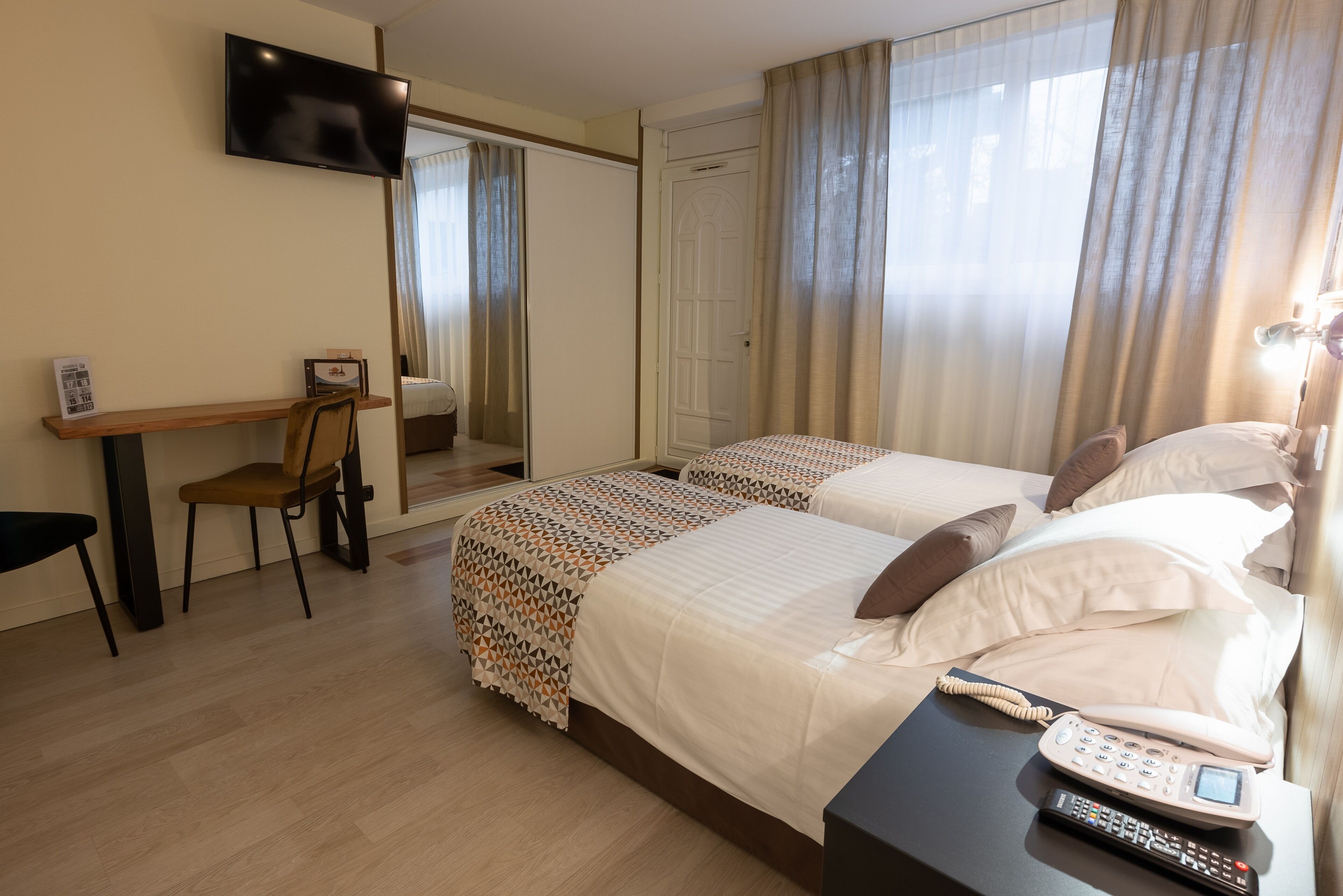 twin room, garden area | in-room safe, individually decorated, individually furnished, desk