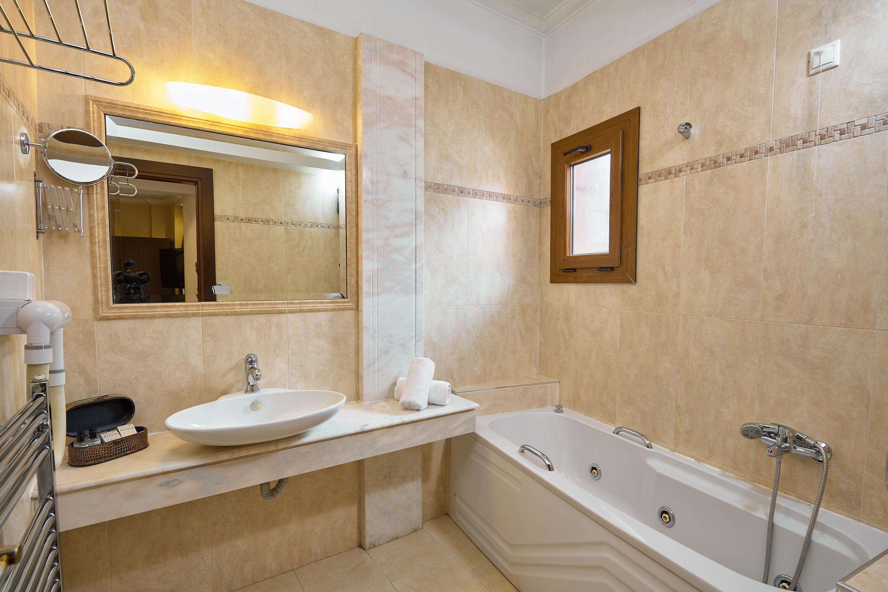 junior suite, fireplace | bathroom | designer toiletries, hair dryer, slippers, towels