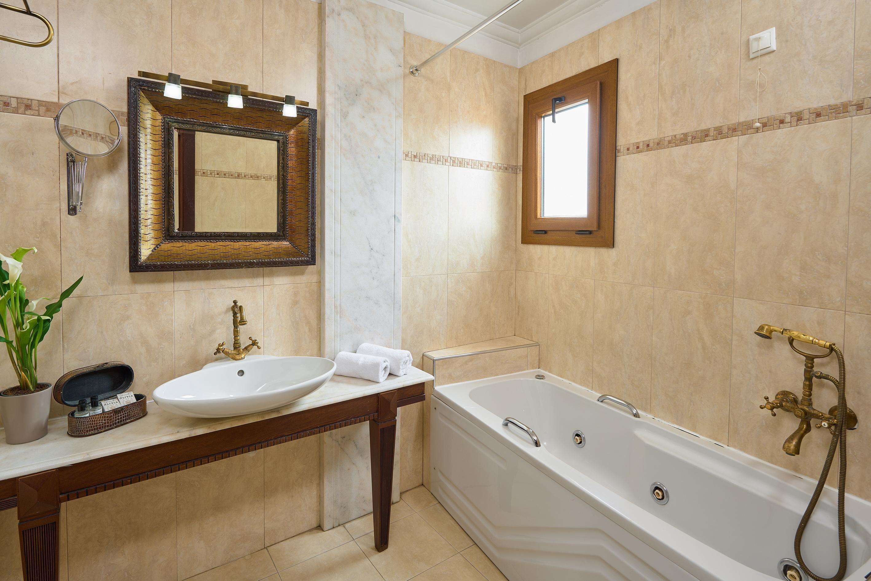 honeymoon suite, jetted tub | bathroom | designer toiletries, hair dryer, slippers, towels
