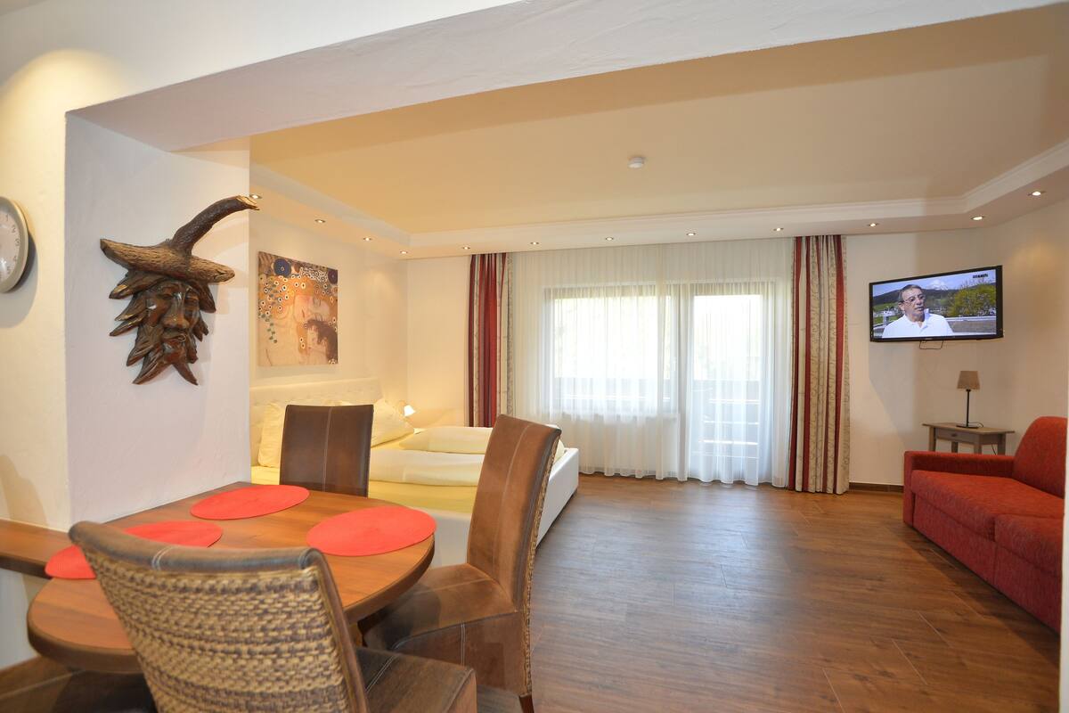 One Bedroom Apartment (Apartment 24) | Living area | Flat-screen TV