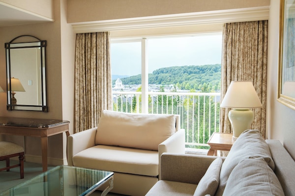 Family Corner Suite, Non-Smoking, Garden View | In-room safe, individually furnished, desk, laptop workspace