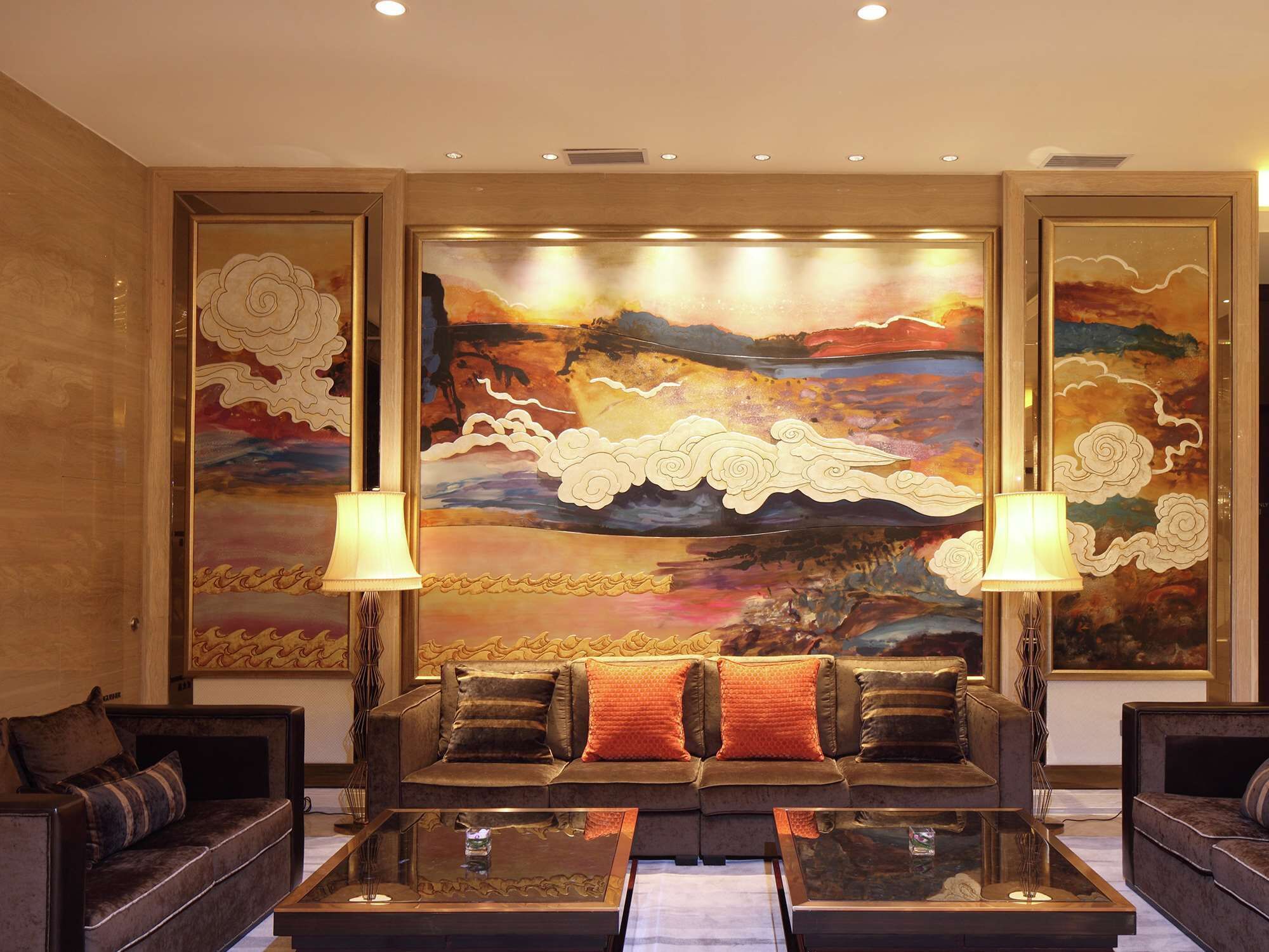 A modern living room with a large abstract painting, two sofas, and two floor lamps.