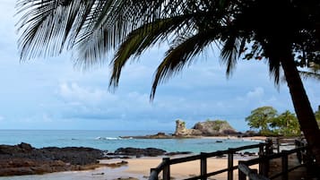 On the beach, white sand, beach towels, fishing