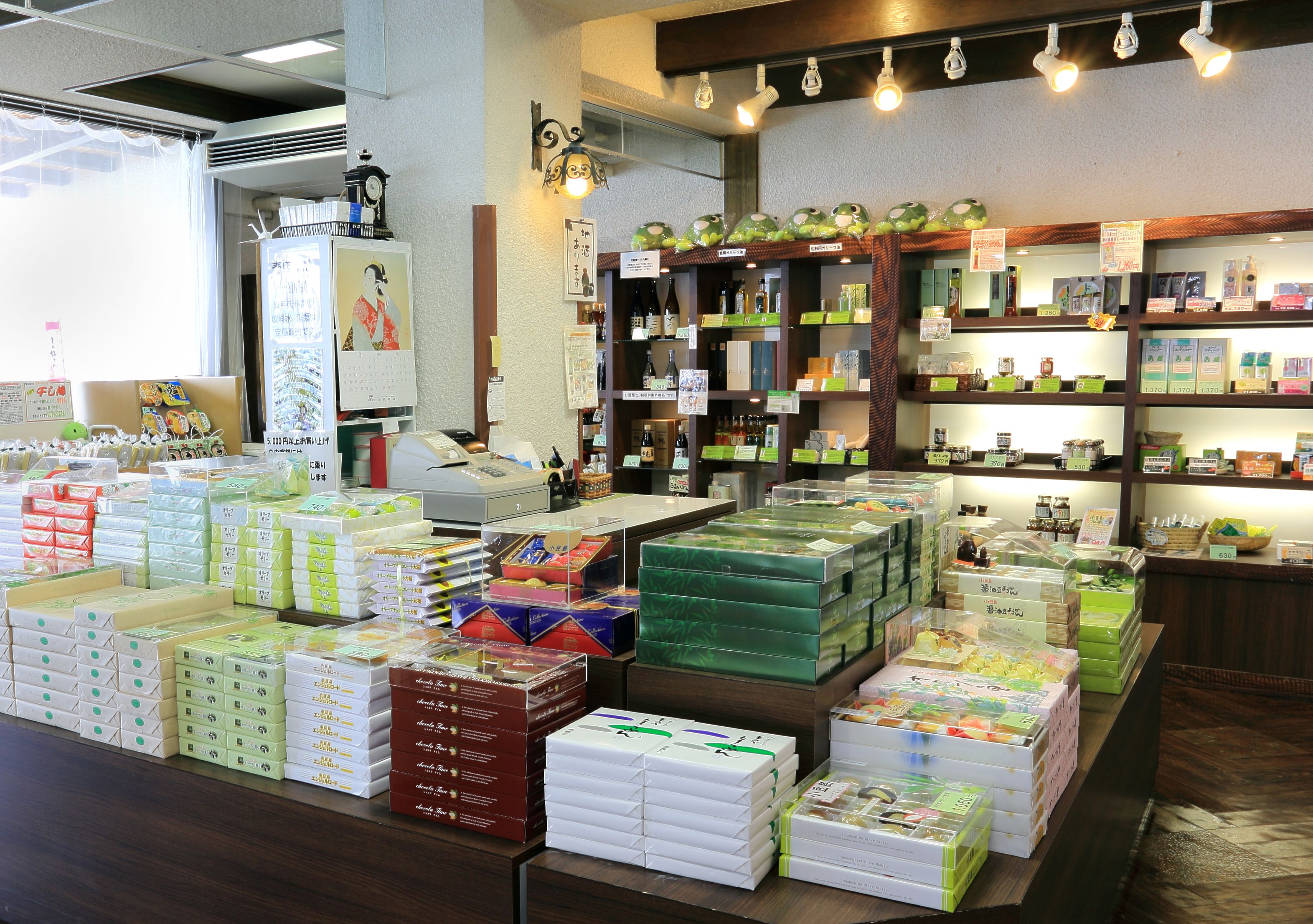 A store with various packaged goods on shelves and tables.