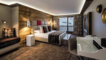 Premium bedding, free minibar items, in-room safe, desk