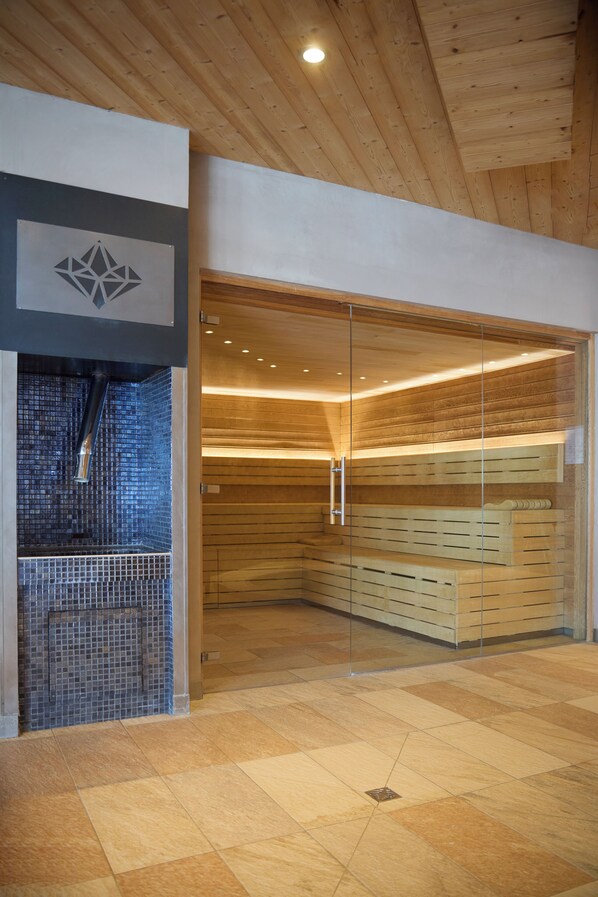 A modern interior with a wooden ceiling, a glass partition, and a tiled floor. - Hôtel Koh-I Nor by Les Etincelles (Les Belleville)