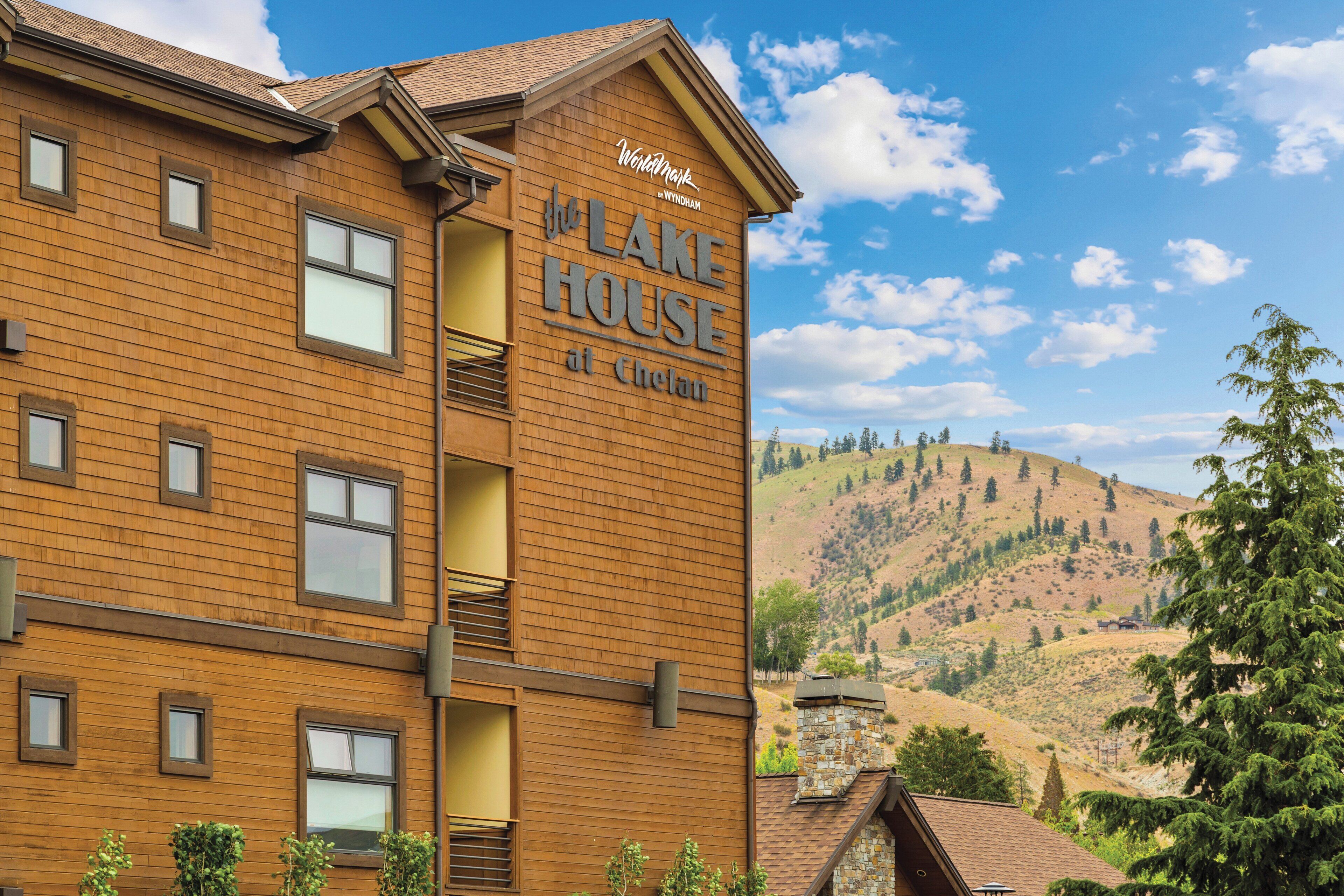 A multi-story building with a sign reading "The Lake House at Chelan."