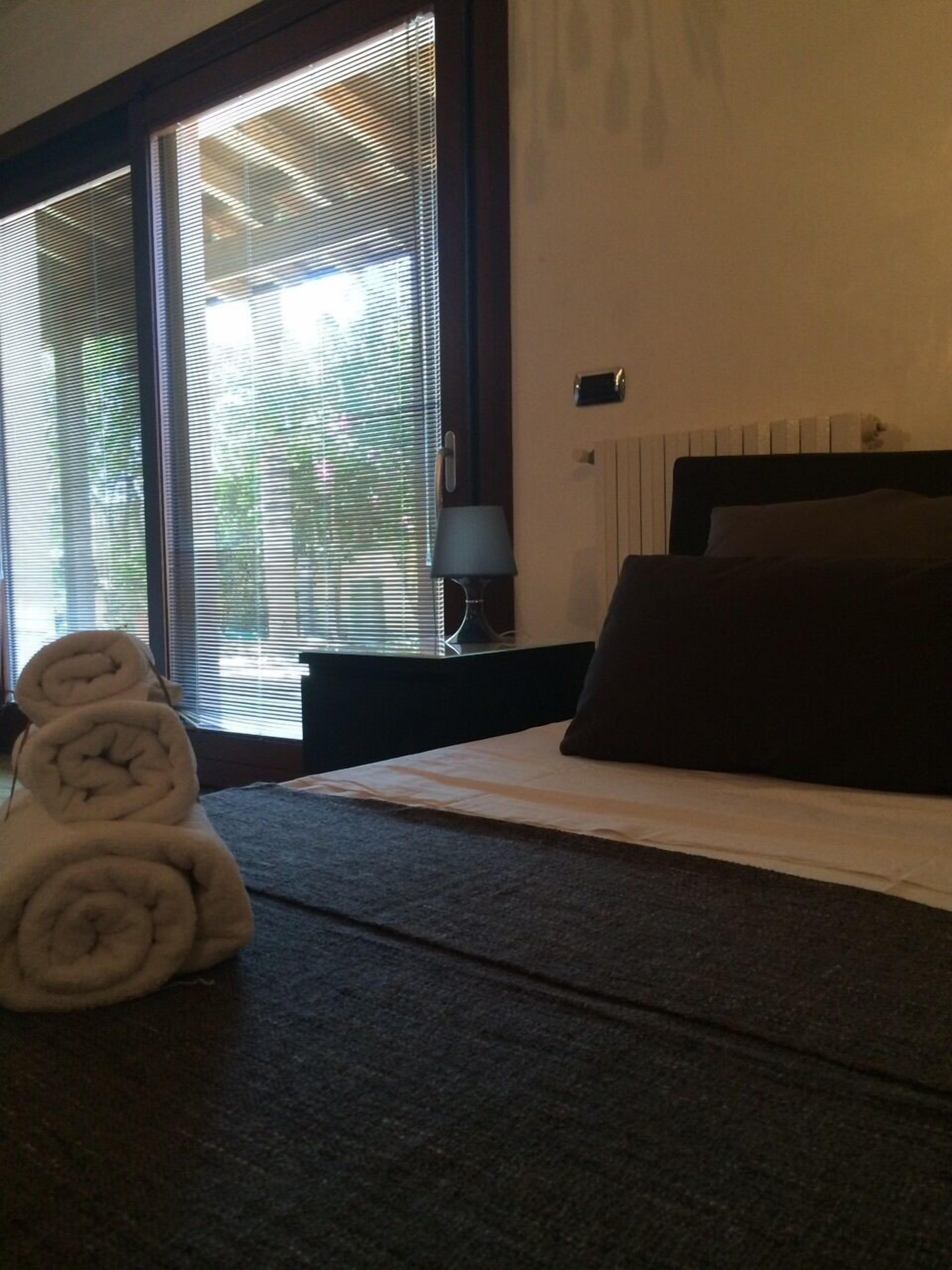 Camera quadrupla | Biancheria da letto di alta qualità, minibar, una cassaforte in camera