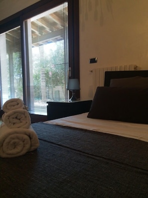 Chambre Quadruple | Literie de qualité supérieure, minibar, coffres-forts dans les chambres