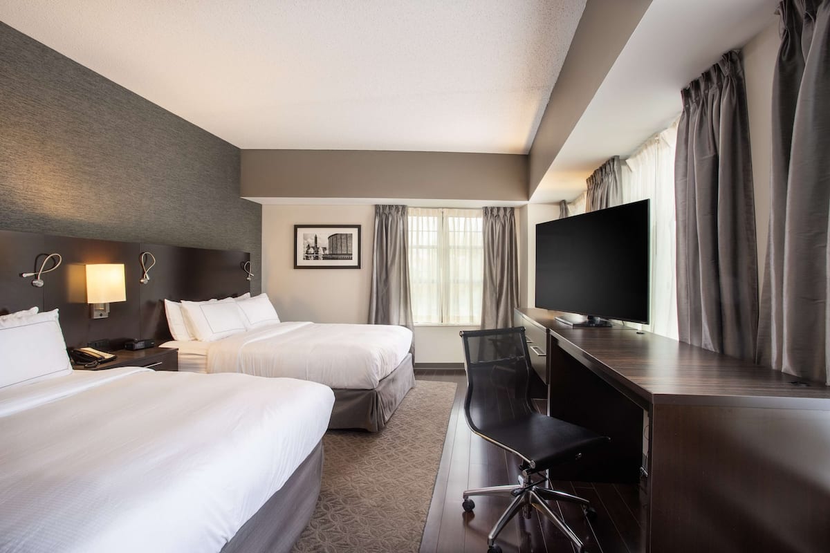 suite, 2 queen beds, non smoking (williams) | premium bedding, pillow-top beds, in-room safe, desk