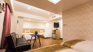 A hotel room with two beds, a desk, a chair, a television, and a small kitchenette. - City Hotel Taipei (Taipei)