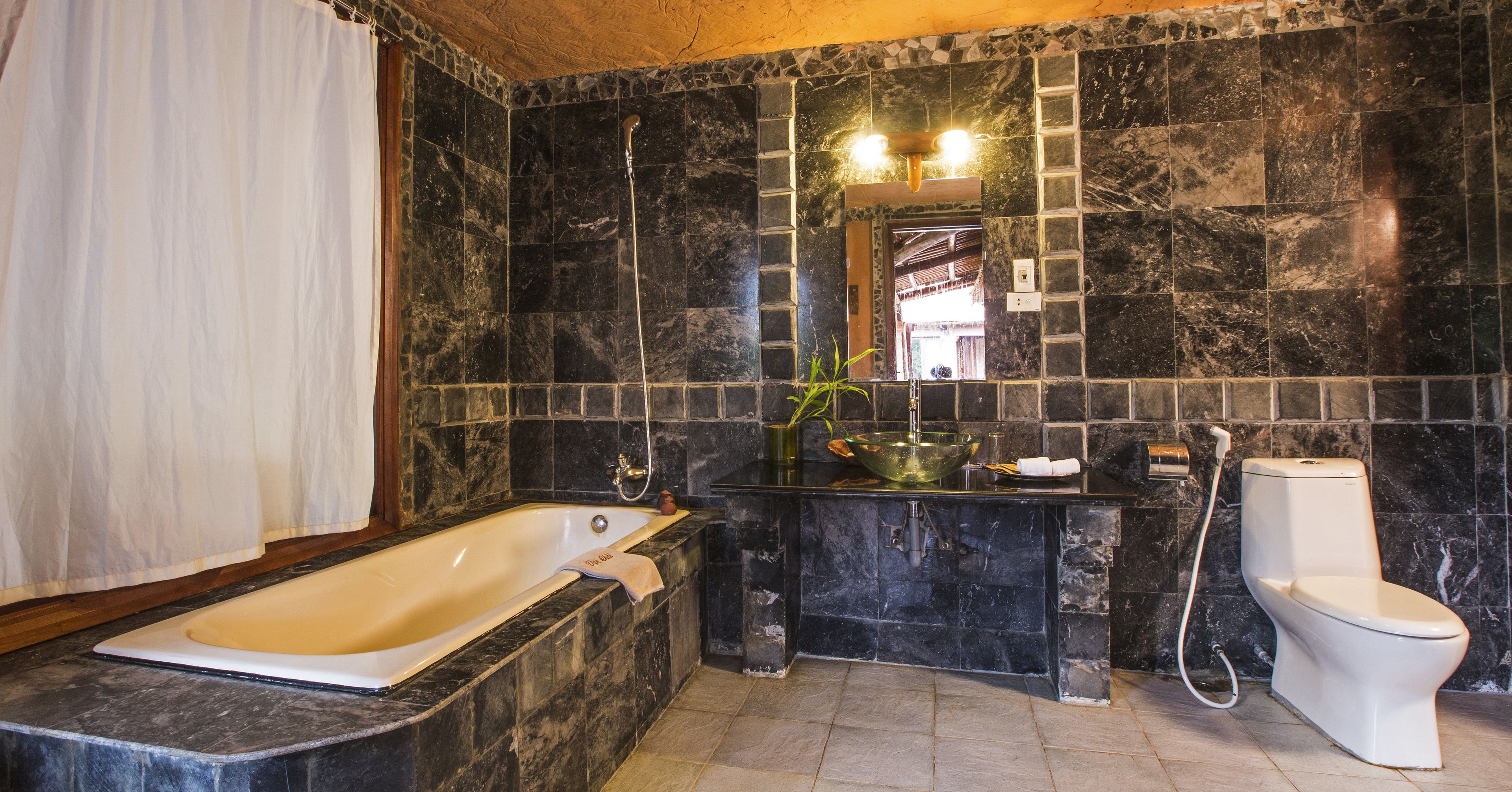 family room (junior) | bathroom | combined shower/bathtub, rainfall showerhead, hair dryer, bathrobes