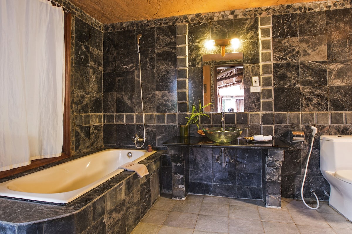 family room (junior) | bathroom | combined shower/bathtub, rainfall showerhead, hair dryer, bathrobes