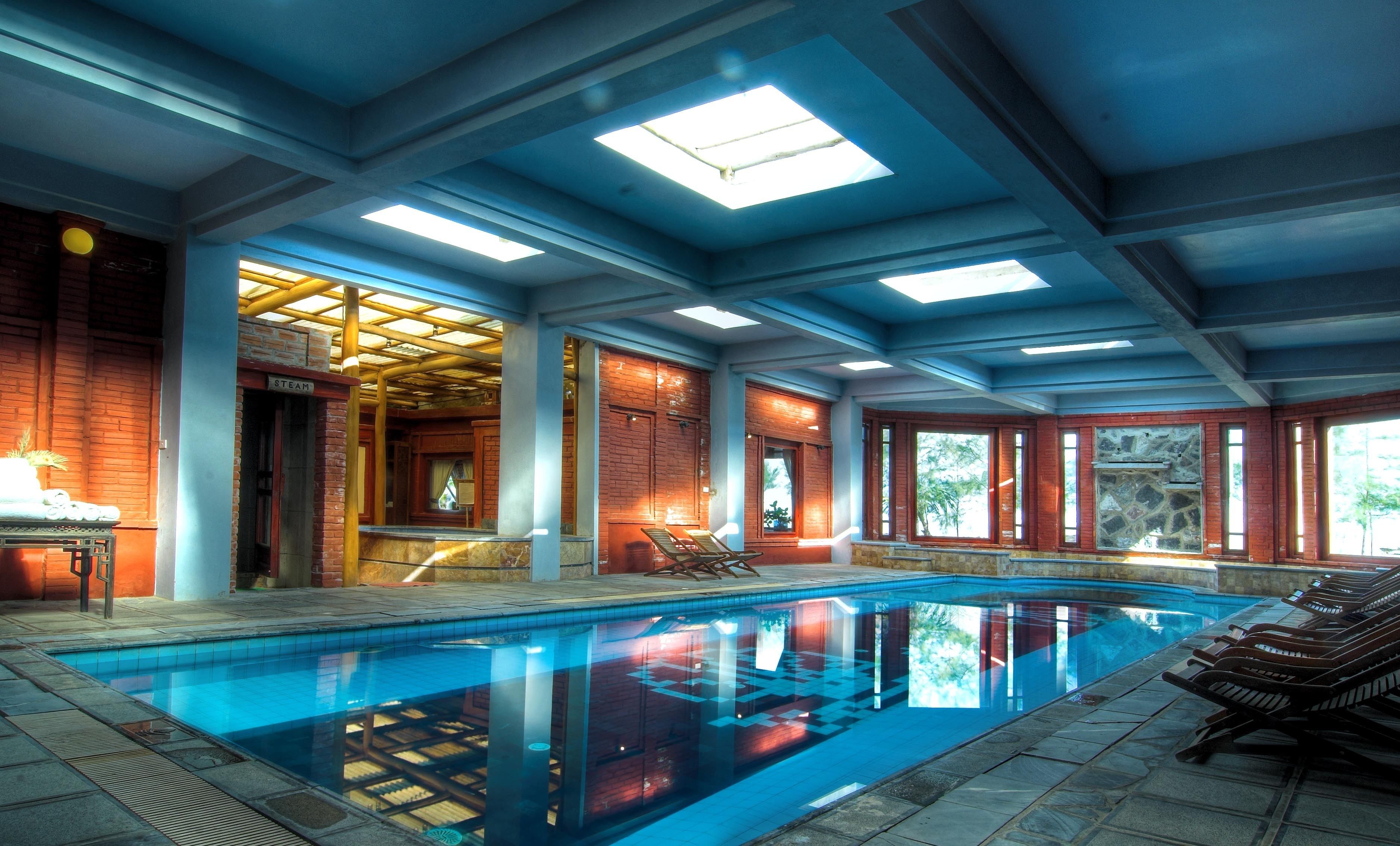 Indoor pool, outdoor pool, free pool cabanas, pool umbrellas