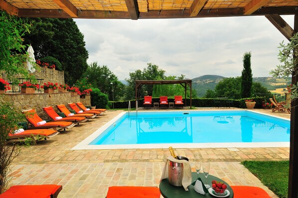 Outdoor pool, a rooftop pool, pool loungers