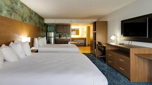 A hotel room with two beds, a TV, a desk, and a kitchenette. - Park Grove Inn (Pigeon Forge)