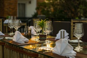Breakfast, lunch, dinner served; local cuisine, pool views 
