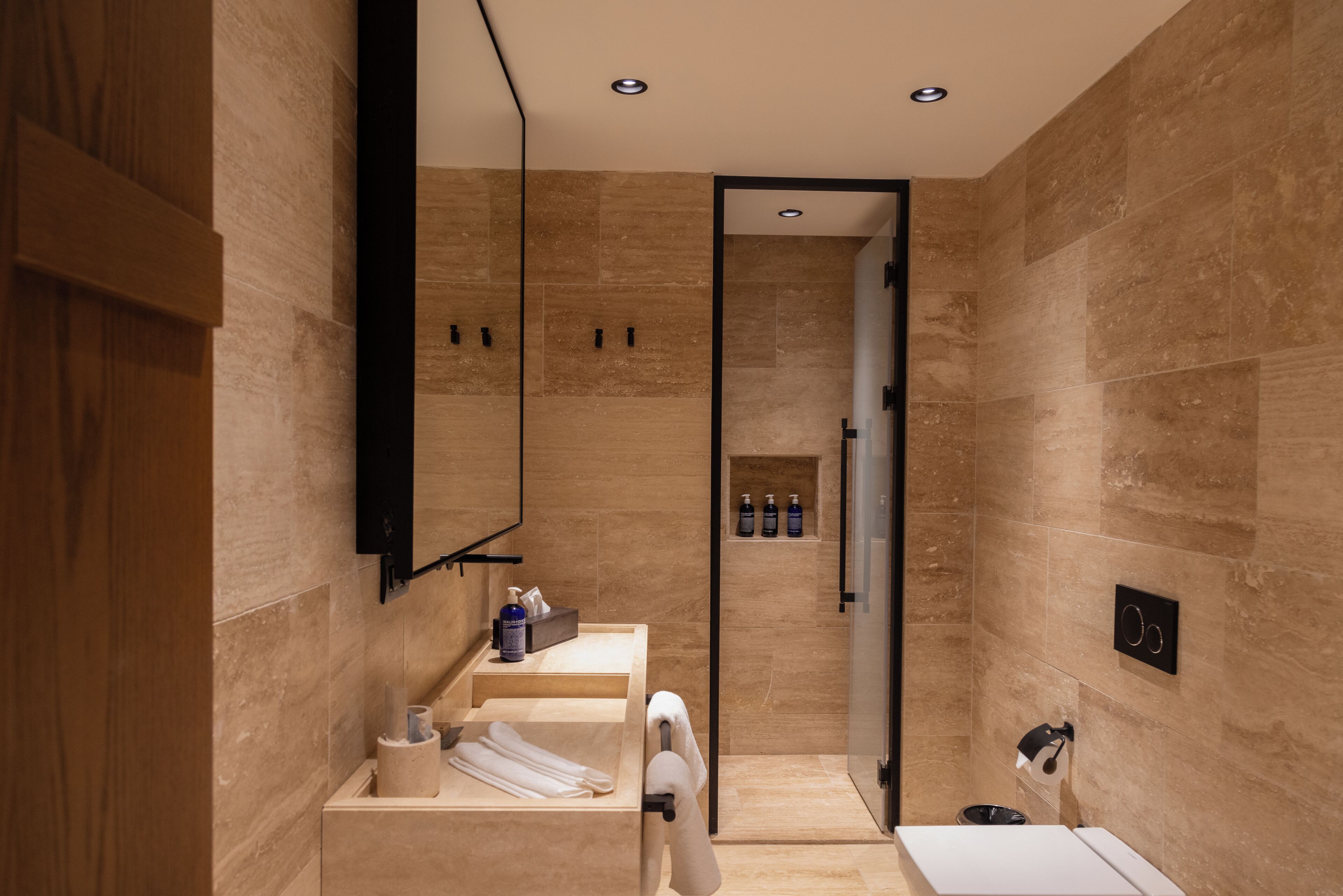 junior suite | bathroom | designer toiletries, hair dryer, bathrobes, slippers