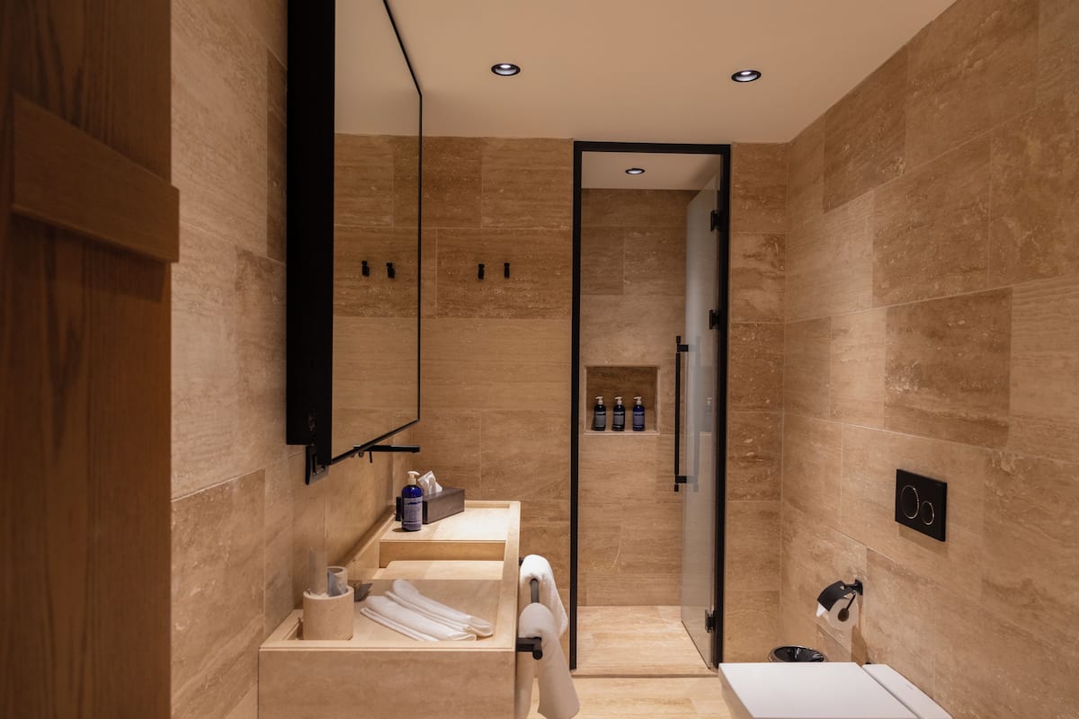 junior suite | bathroom | designer toiletries, hair dryer, bathrobes, slippers