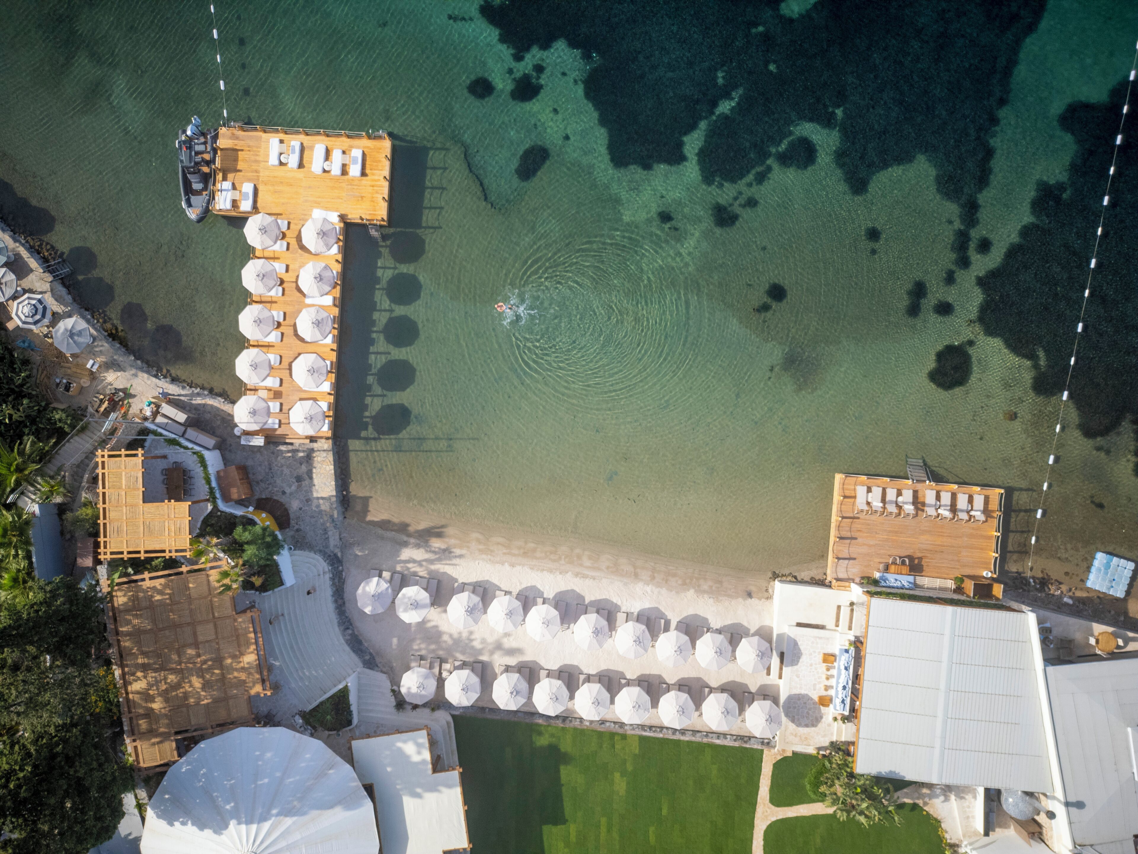 private beach, white sand, sun-loungers, beach umbrellas