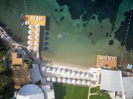 Private beach, white sand, sun loungers, beach umbrellas