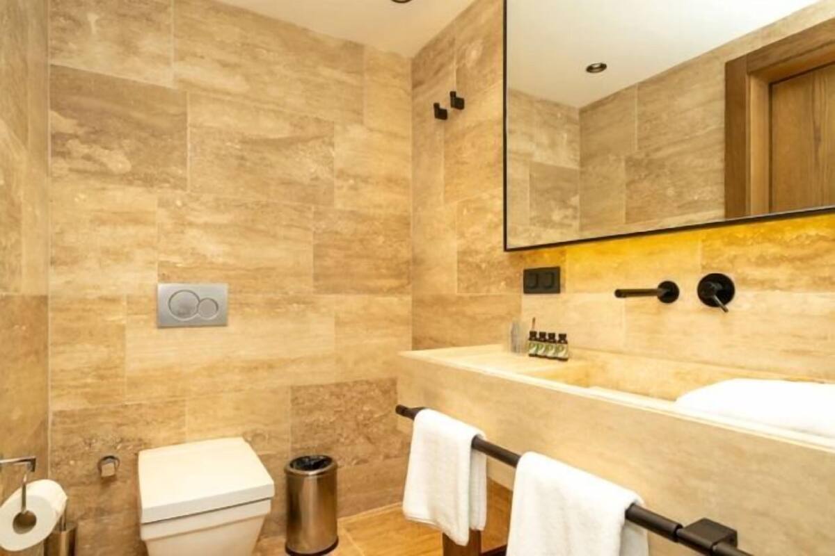 Bathroom | Designer toiletries, hair dryer, bathrobes, slippers