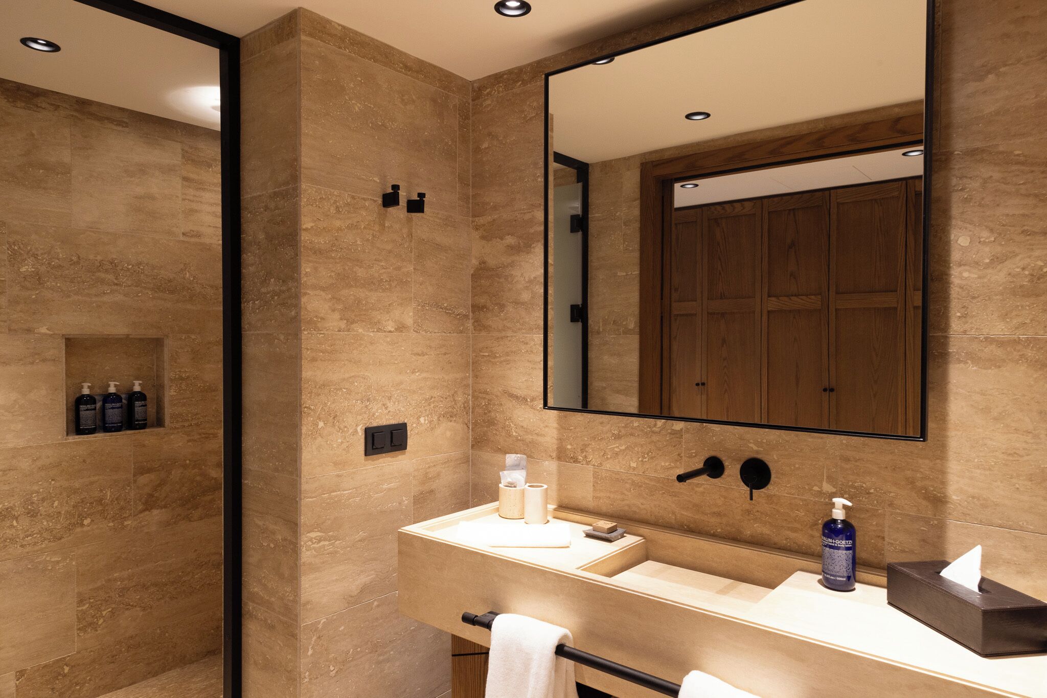 designer toiletries, hair dryer, bathrobes, slippers