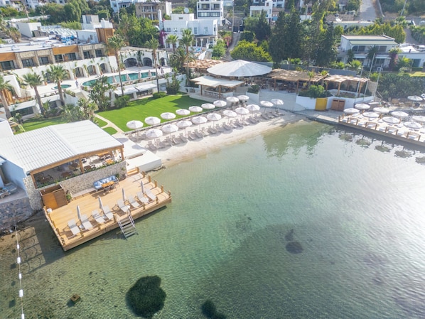 Private beach, white sand, sun loungers, beach umbrellas