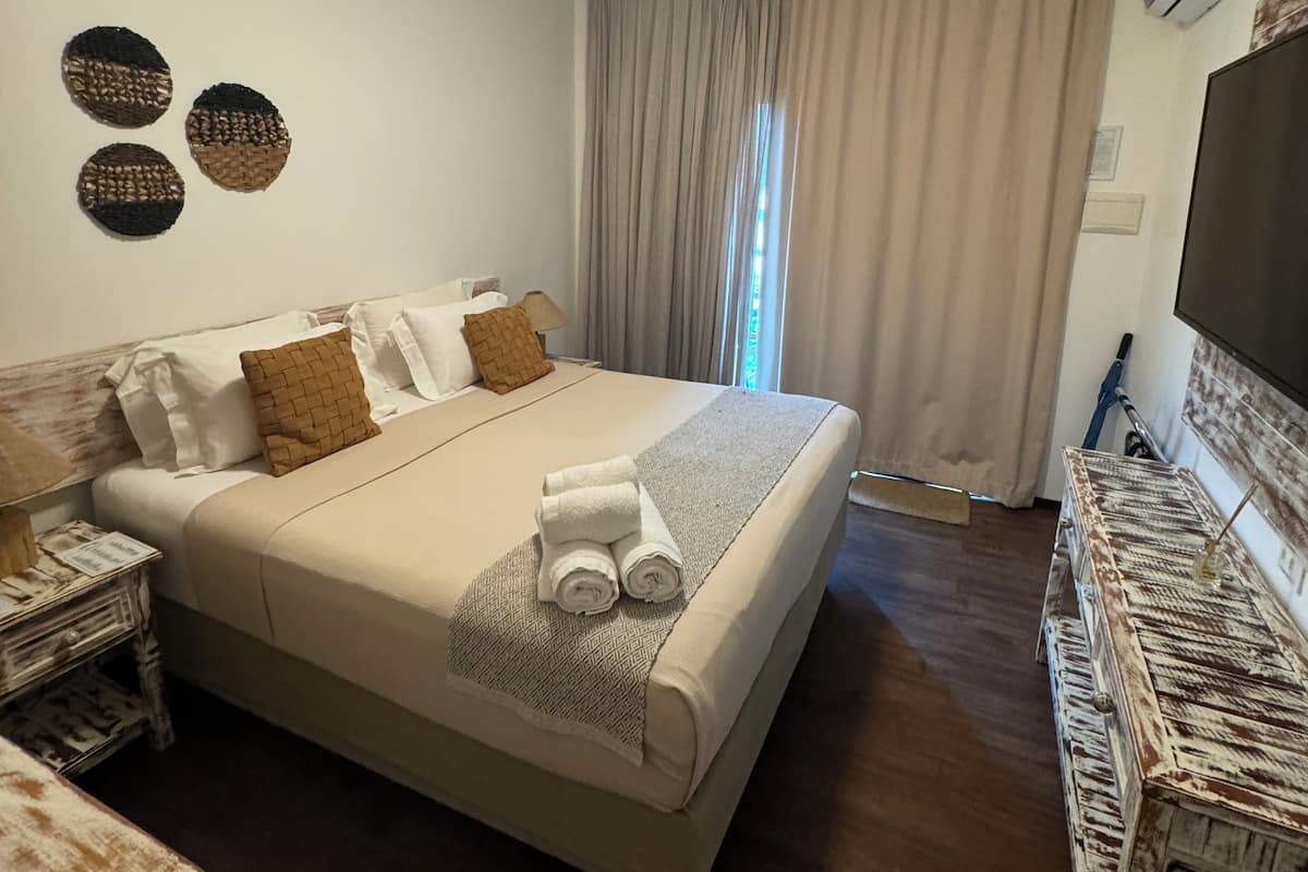 Minibar, blackout curtains, iron/ironing board, bed sheets