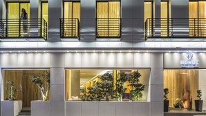 A hotel with a modern facade, large windows, and a balcony with railings. - O Monot Hotel (Beirut)